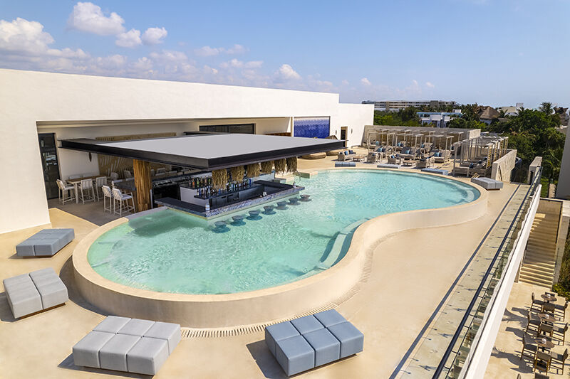 Desire Riviera Maya Jacuzzi Lounge with swim-up bar, a couples-only area where intimacy is permitted