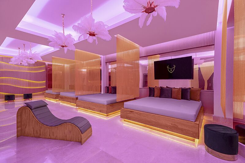 Desire Riviera Maya Playroom with large padded beds and pink lighting, a couples-only space where intimacy is permitted